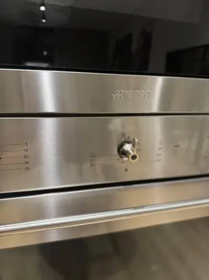 a close up of a stainless steel microwave oven at Homely - 1 bedroom rental unit at Ellipse in Midrand