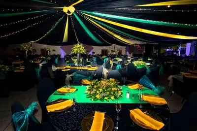 a banquet hall with tables with yellow and green at Bolivia Lodge in Polokwane