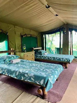 a bedroom with two beds in a tent at Kaoxa Bush Camp in Alldays