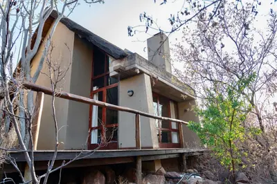 a house on top of a mountain at The Riverine Lodge in Welgevonden Game Reserve