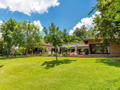 a house with a lawn in front of it at African Dream Villa in White River