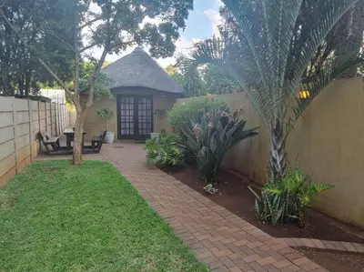 a house with a brick walkway in front of a yard at Lyttelton Self-Catering Accommodation in Centurion