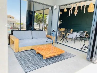 a couch and a coffee table on a patio at Peaceful Nest in Midrand