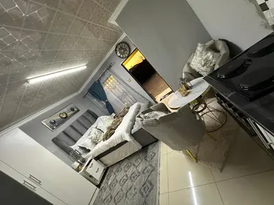 an overhead view of a small kitchen with a stove at StayComfyGuesthouseByPunky in Soshanguve