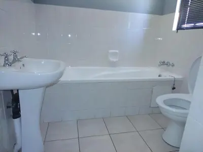 a bathroom with a sink and a tub and a toilet at 27 Pendleberry Grove, Chris Hani Drive, Bela-Bela in Bela-Bela