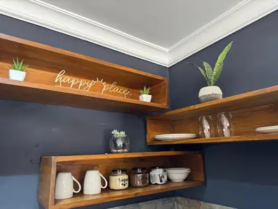 a room with wooden shelves with plants on them at Spacious stay-in 1bedroom apartment in Kempton Park
