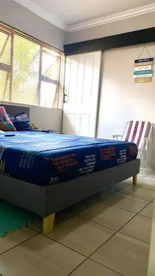 a bed in a room with a blue mattress at SummerPlace Guest Rooms in Modimolle