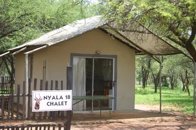 a small building with a sign in front of it at Grootgeluk in Naboomspruit