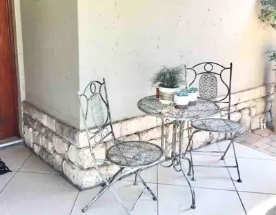 a table and two chairs on a patio at VILLA GUEST Suite in Pretoria