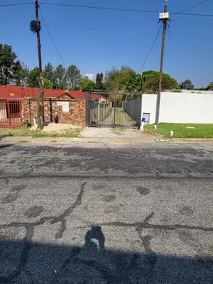 a shadow of a person on the street at Limewood Pool view in Sandton