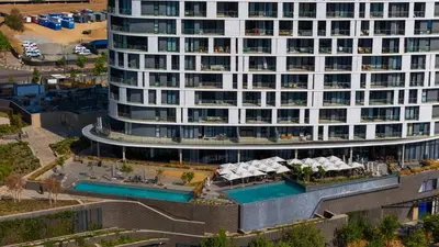an aerial view of a building with a swimming pool at Waterfall Luxury Suites in Midrand