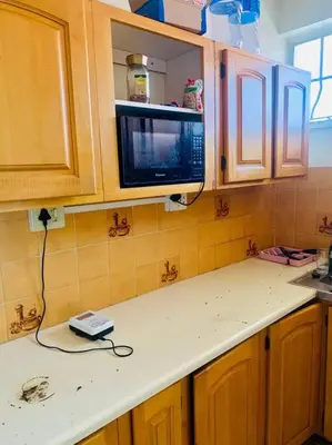 a kitchen with a counter top with a microwave at Spacious, Budget-Friendly Stay in Pretoria