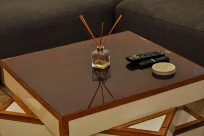 a coffee table with a vase on top of it at Spacious, Budget-Friendly Stay in Pretoria