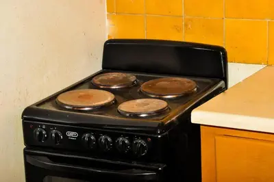 a stove in a kitchen with four pancakes on it at Spacious, Budget-Friendly Stay in Pretoria