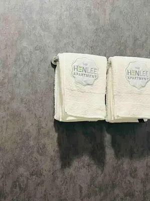 two towels are sitting on a wall at The Henlee Apartment on New - Power Backup, Gym ,Pool in Midrand