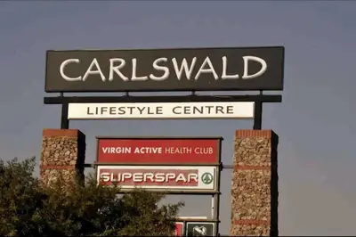 a sign for a car dealership at The Henlee Apartment on New - Power Backup, Gym ,Pool in Midrand