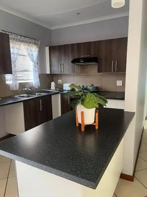 a kitchen with a plant sitting on a counter at Homie my home in Centurion