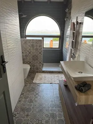 a bathroom with a sink and a tub and a toilet at Casa Galetti in Hartbeespoort