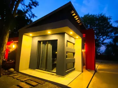 a small house is lit up at night at Kwena Guesthouse in Groblersdal