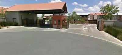 an empty parking lot in front of a building at Luxuriously finished 2 bedroom in Midrand