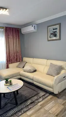 a living room with a couch and a table at Luxuriously finished 2 bedroom in Midrand