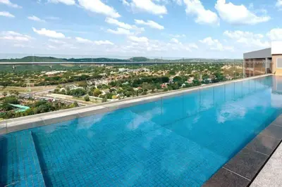 a large swimming pool on top of a building at El Mayor Deluxe Suite MENLYN MAINE in Pretoria