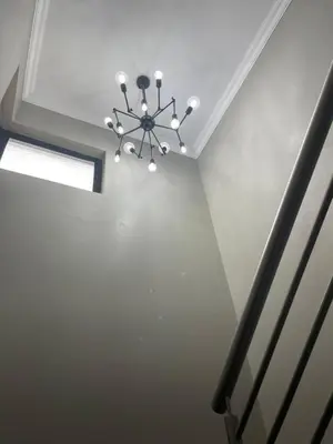 a ceiling with a chandelier in a room at Luxury Escape OR Tambo International in Kempton Park