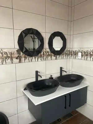a bathroom with two sinks and mirrors on the wall at Luxury Escape OR Tambo International in Kempton Park