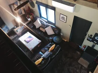 an overhead view of a living room with a leather couch at Lions Gate in Marloth Park