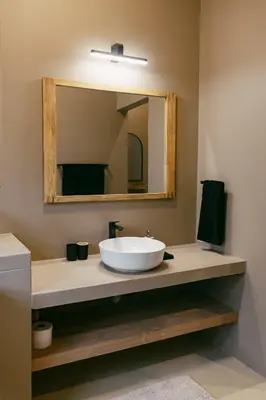 a bathroom with a sink with a large mirror at Leopard's Villa, Marloth Park in Marloth Park