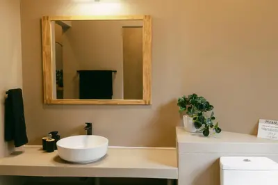 a bathroom with a sink and a mirror at Leopard's Villa, Marloth Park in Marloth Park