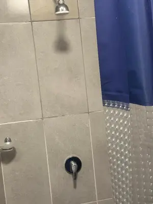 a shower stall with a shower head and a shower at Safaya Inn in Kempton Park