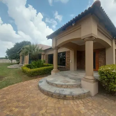 a house with a patio in front of it at Mia's Accomidation in Kempton Park