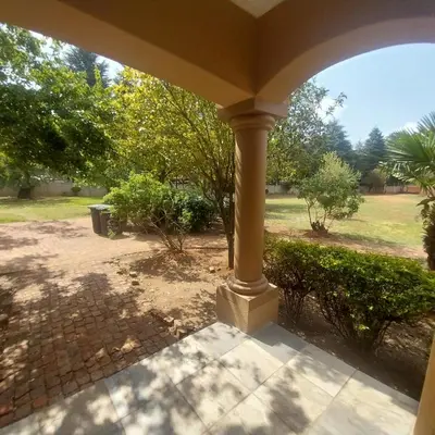 a porch with a view of a yard at Mia's Accomidation in Kempton Park