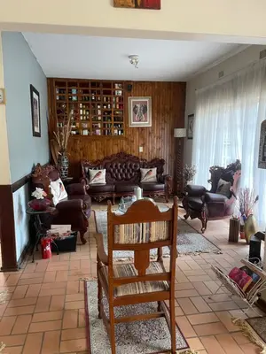 a living room with couches and a table at The Ridge in Pretoria