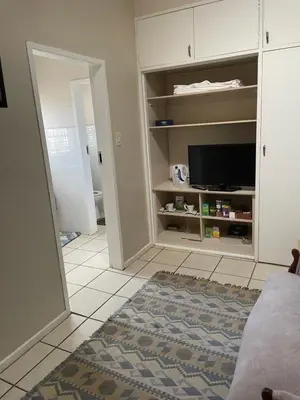 a living room with a flat screen tv and a living room at The Ridge in Pretoria
