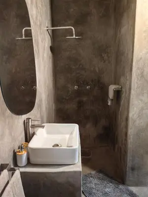 a bathroom with a white sink and a mirror at Noah's Ark in Marloth Park