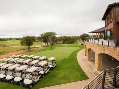 a group of golf carts parked on a golf course at Euphoria Golf Estate House 196 Rooibok in Naboomspruit