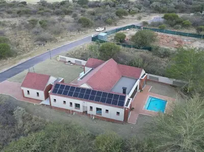 an aerial view of a house with solar panels on it at Euphoria Golf Estate House 196 Rooibok in Naboomspruit