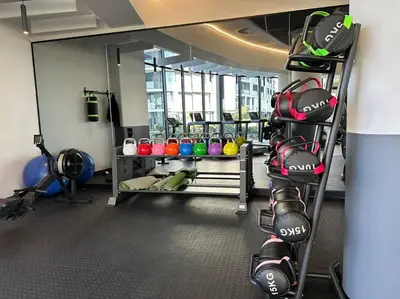 a gym with a rack of equipment in a room at Your Oasis in Waterfall City in Midrand