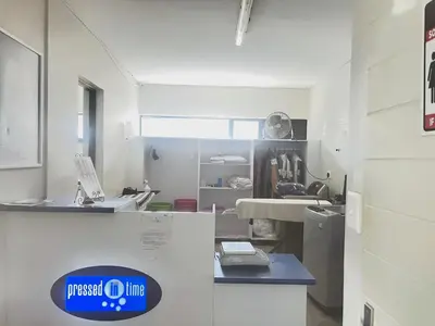 a white room with a counter and a sink at Secure 1 Bedroom Apartment in Midrand, Waterfall City - Lock Up and Go - Free WIFI and Parking - 4A Elizabeth Place in Midrand