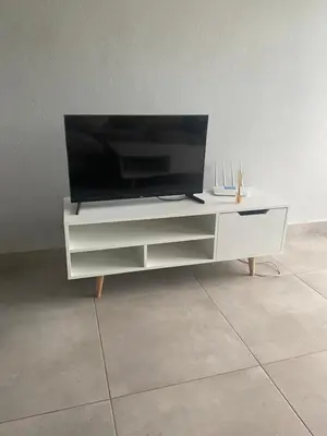 a white entertainment center with a flat screen tv on it at One Bedroom Apartment at Circa in Pretoria