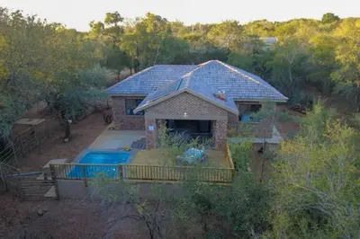 an aerial view of a house with a swimming pool at Krokodil Rus in Marloth Park