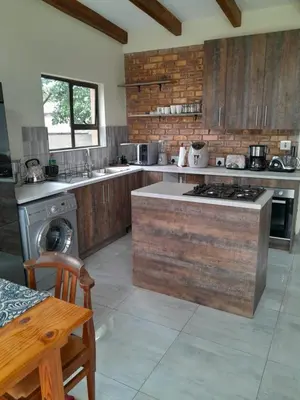 a kitchen with a stove and a counter top at Transit Haven - 2 Bed Retreat in Kempton Park
