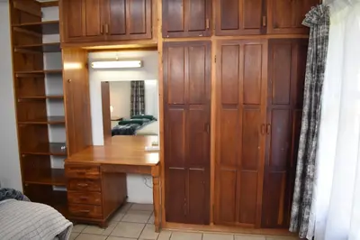 a dressing room with a desk and a mirror at 39 on Clarendon in Graskop