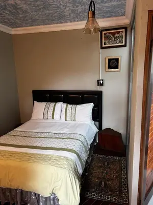 a bedroom with a bed in a room at Garden Studio in Waterkloof Ridge in Pretoria