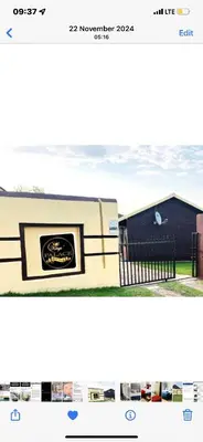 a picture of a house with a stove at KINGs' PALACE GUESTHOUSE in Ermelo