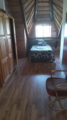 a bedroom with a bed in a attic at Okgethilwe Lodge in Sabie