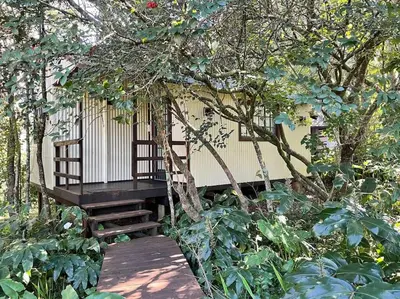 a tree house with a swing in a garden at Eindelik on Setlaars in Graskop