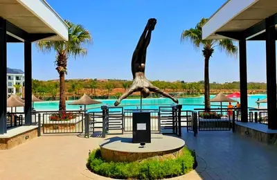 a statue of a person in the middle of a pool at The Blyde Couple Suite in Pretoria